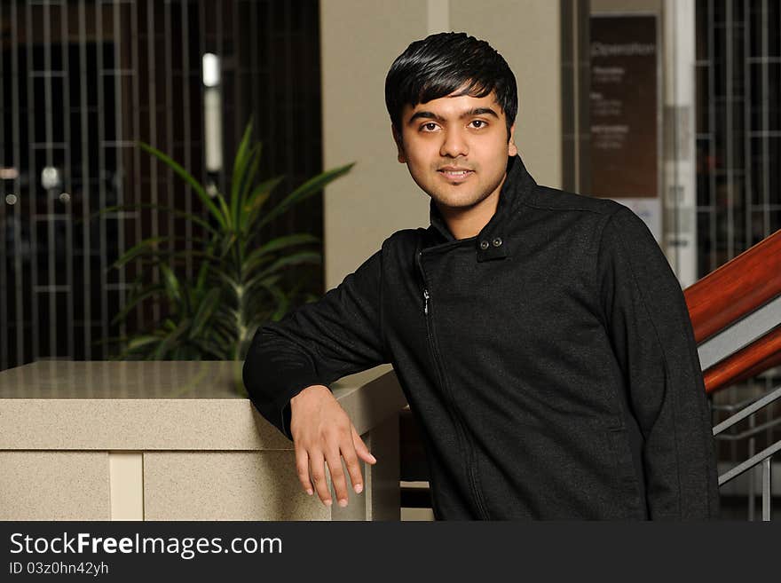 Eastern College Student smiling inside a college building. Eastern College Student smiling inside a college building