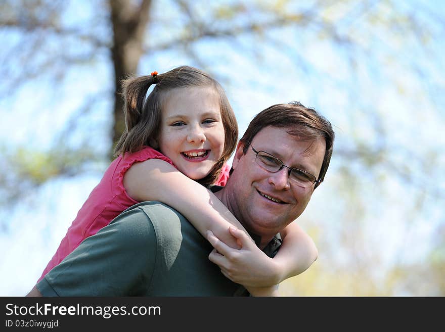 Father and Daughter Having Fun outdoors on a sunny day. Father and Daughter Having Fun outdoors on a sunny day