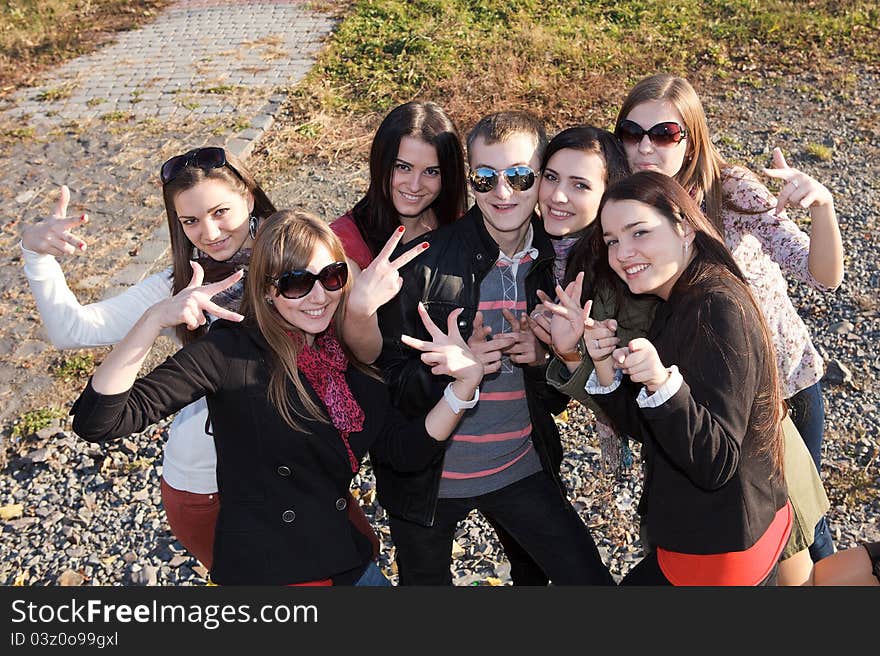 Happy Group of male and female students in park