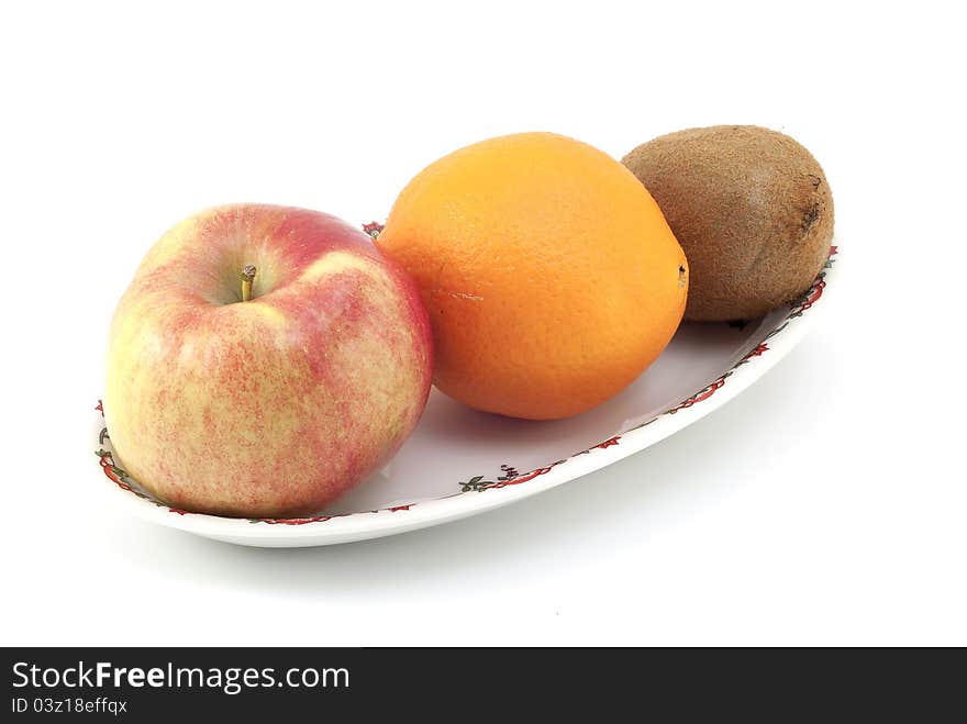 Fruit bowl with apple, orange and kiwi on a  white background.