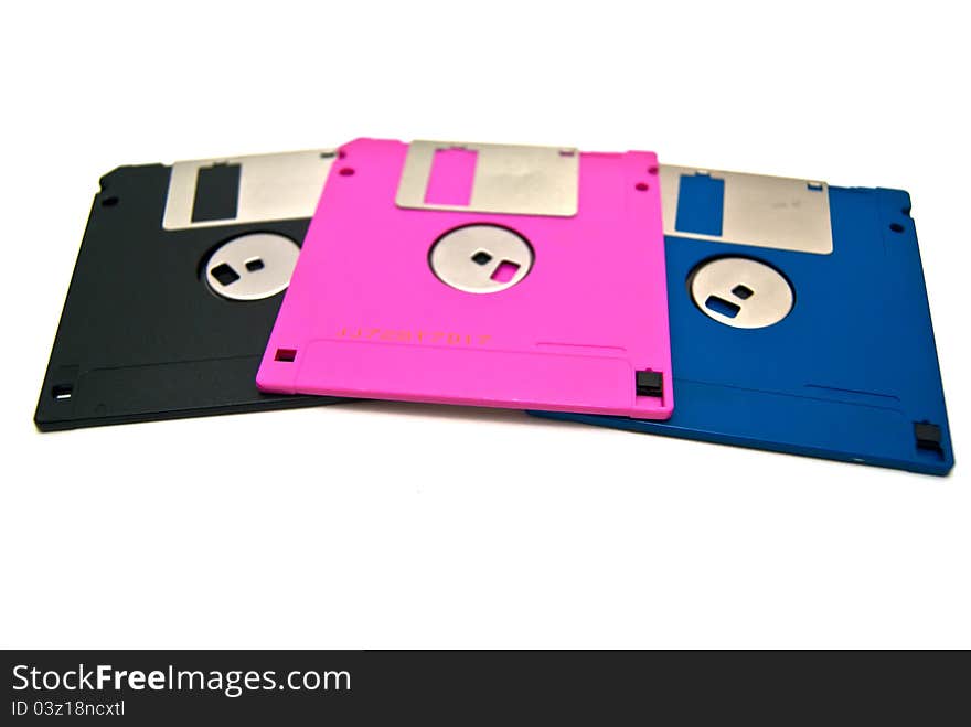 The different color diskettes on white