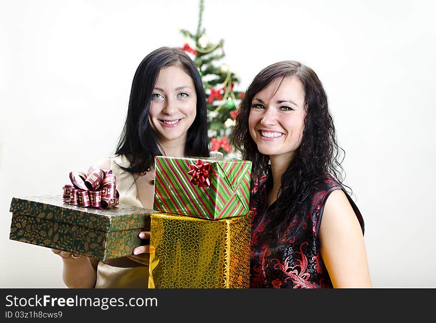 Christmas or new year party: Two girls with gifts. Christmas or new year party: Two girls with gifts