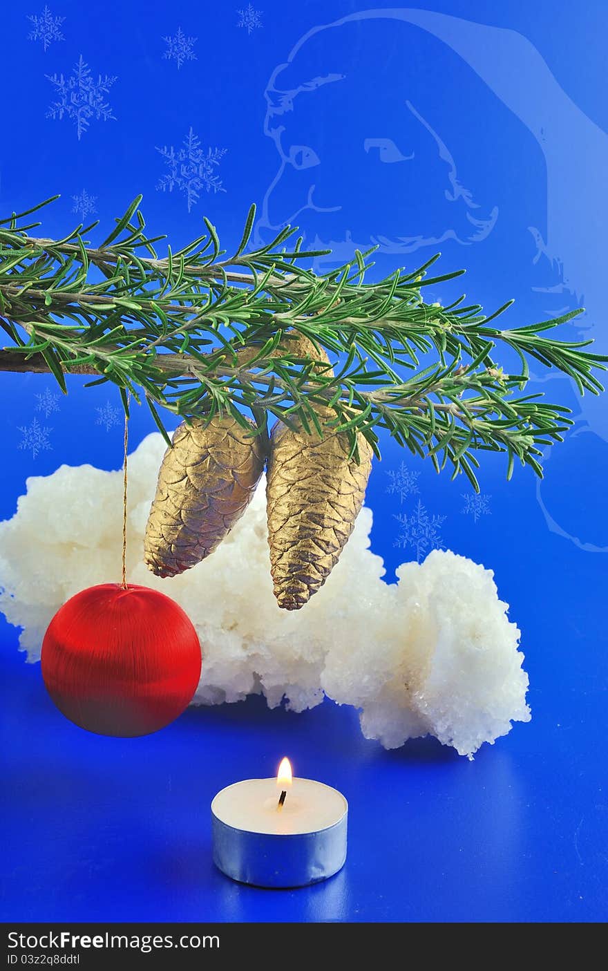 Red balls, cone spruce, ice and sprigs to decorate and candles burning for Christmas, against a blue background. Red balls, cone spruce, ice and sprigs to decorate and candles burning for Christmas, against a blue background