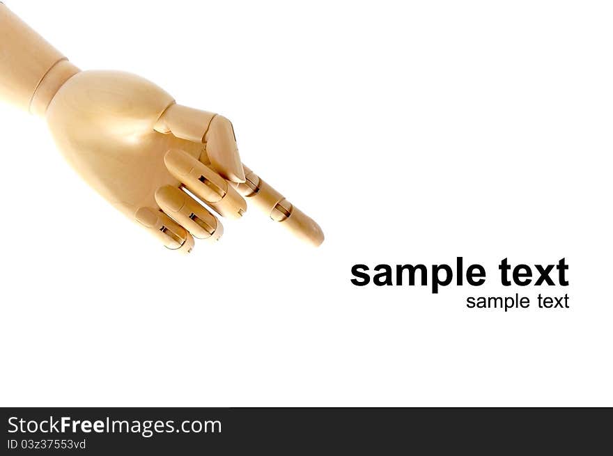 Wooden hand model pointing to text on white background. Wooden hand model pointing to text on white background