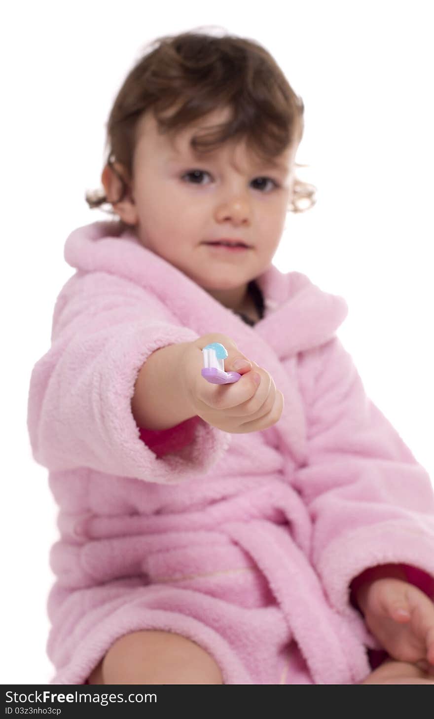 Little girl proposing her tooth brush