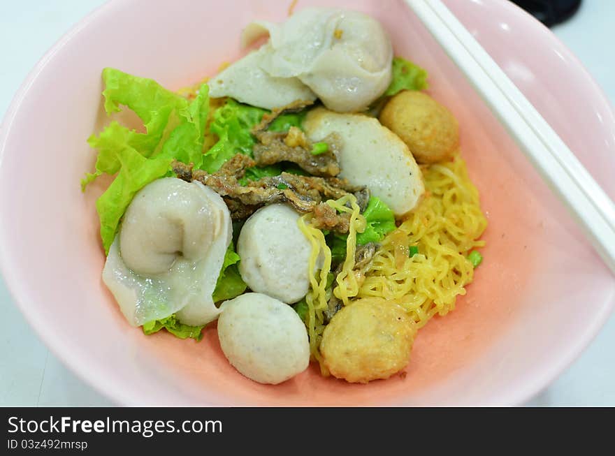 Asian style noodle with pork , fish ball and vegetables. Asian style noodle with pork , fish ball and vegetables