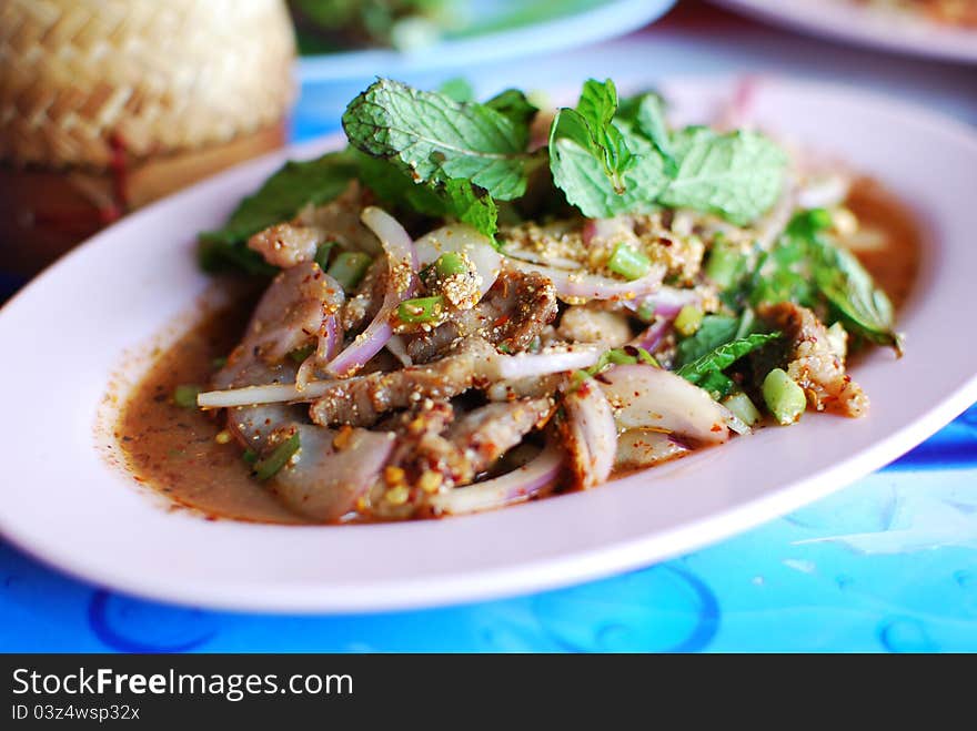 Spicy salad of grilled pork with Thai style food set , Asian style food in Thailand