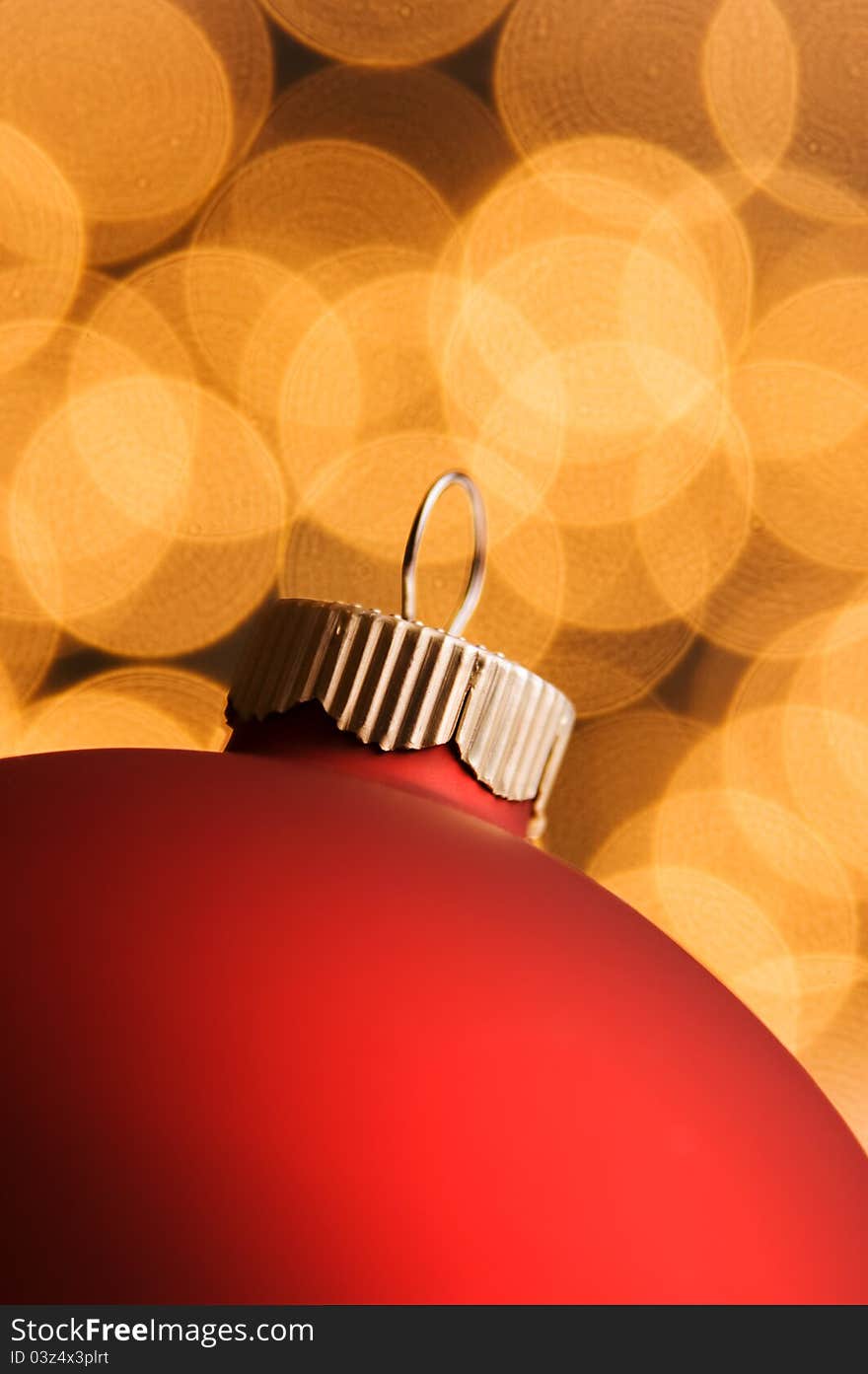 Red ornament with gold defocused lights