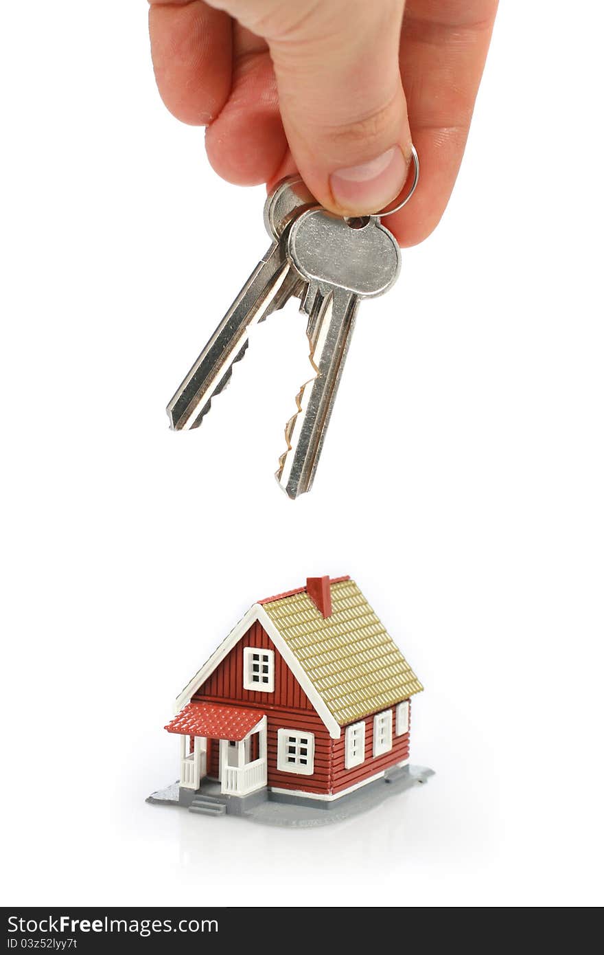 Keys and little house isolated over white background. Keys and little house isolated over white background.