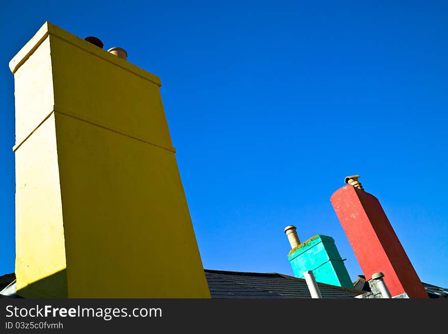 Colorful chimneys, with a blue sky, Devon, Uk