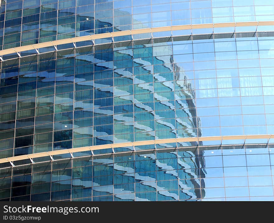 Reflections on office building blue glass wall. Reflections on office building blue glass wall