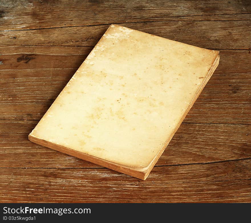 Old book on old wooden background