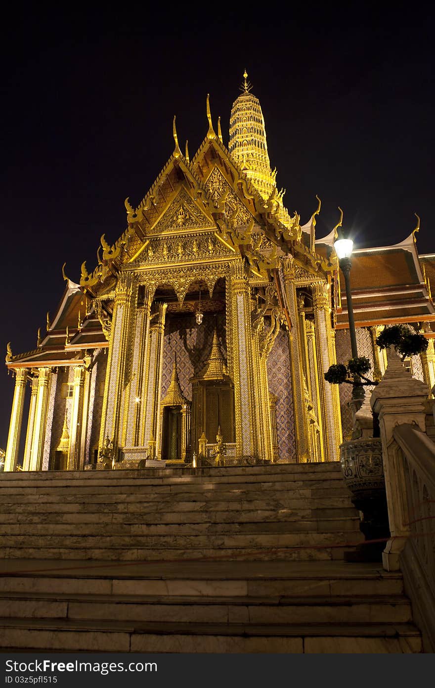 Buddhist temple Grand Palace at night in Bangkok, Thailand