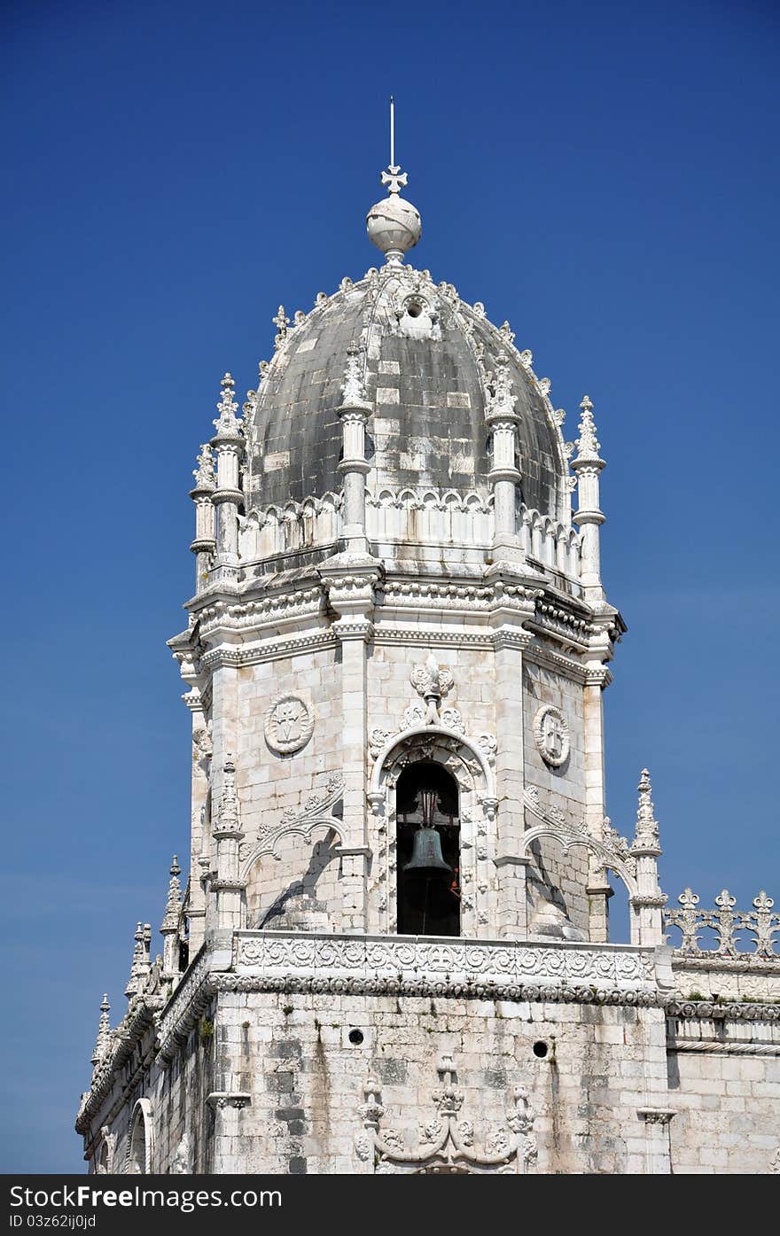 This intricately carved tower, housing the bells, is near the front entrance of the monastery of Jeronimos in Lisbon portugal ( mosteiro dos jeronimos ). This intricately carved tower, housing the bells, is near the front entrance of the monastery of Jeronimos in Lisbon portugal ( mosteiro dos jeronimos )