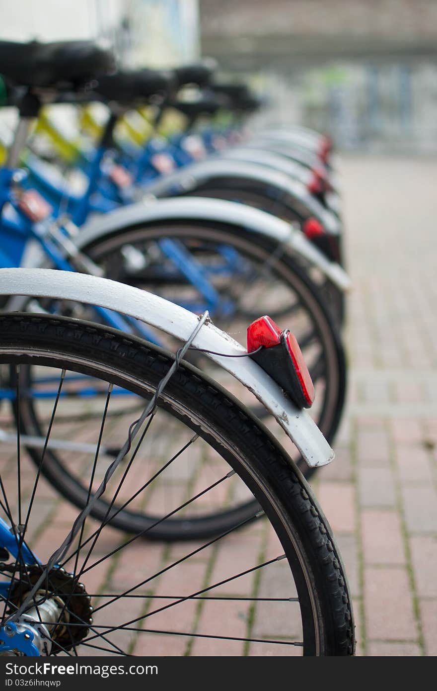 Parked bicycles to be rented. Parked bicycles to be rented