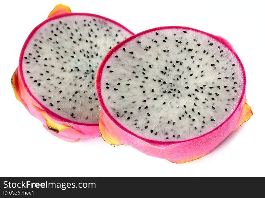 Closeup photo of fresh Dragon Fruit cut in half, on white background