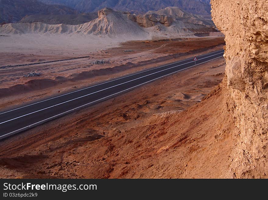 High road in stone desert