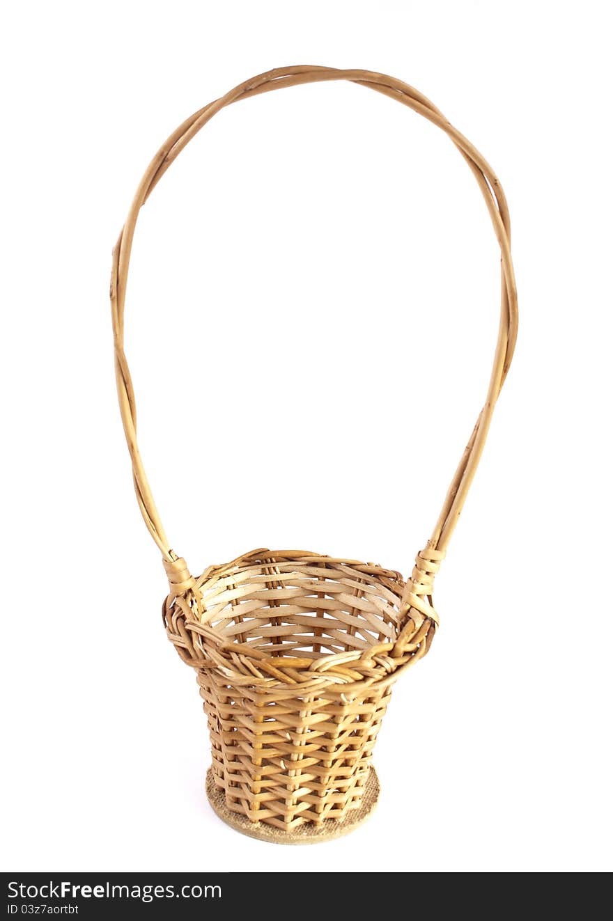 Empty brown wicker basket isolated on white