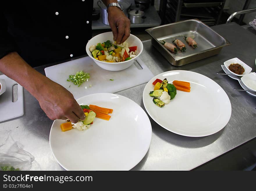 Restaurant Chef Preparing A Plate