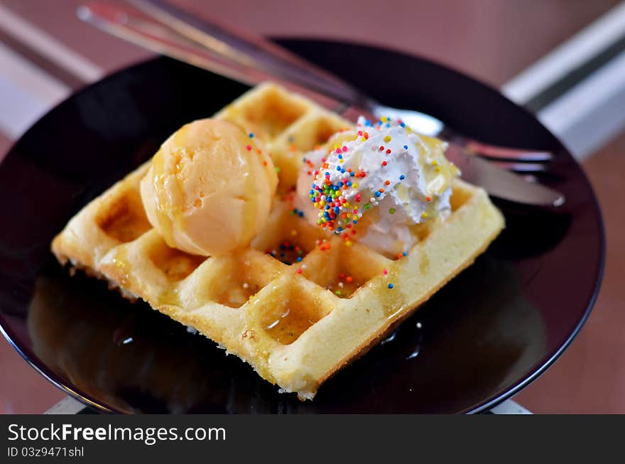 Waffle and whipping cream with vanilla ice cream