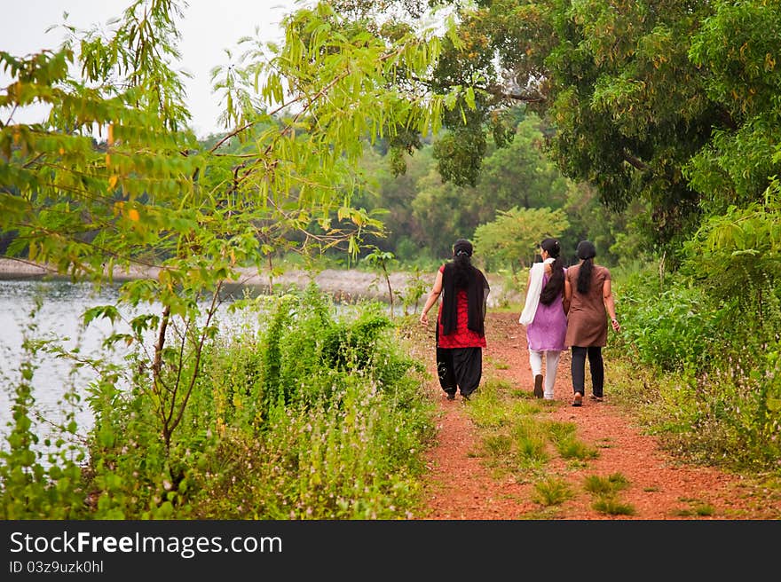 Three indian female at morning very near to lake. Three indian female at morning very near to lake