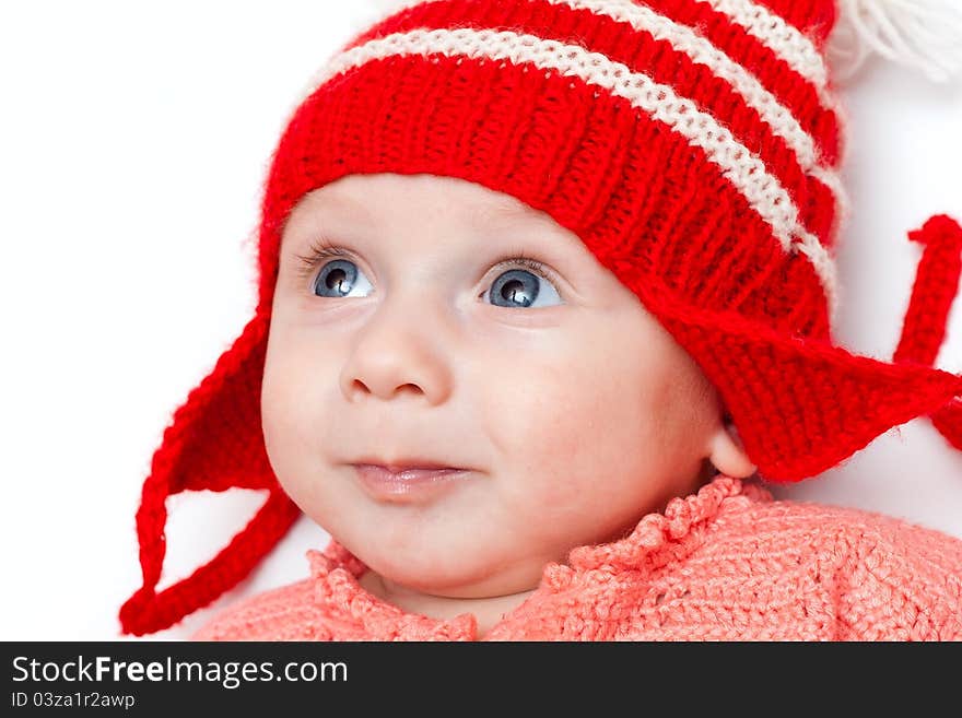 Cute smiling baby in red hat on white. Cute smiling baby in red hat on white