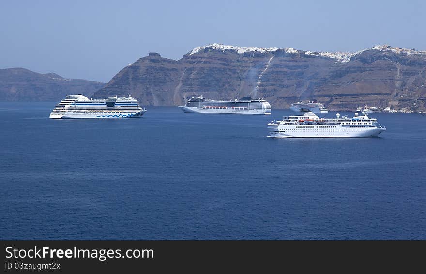 A  view from a cruiseship on Santorini Greecewith cruiseships. A  view from a cruiseship on Santorini Greecewith cruiseships