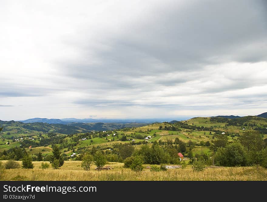 Mountain Village Landscape With Dramatic Sky