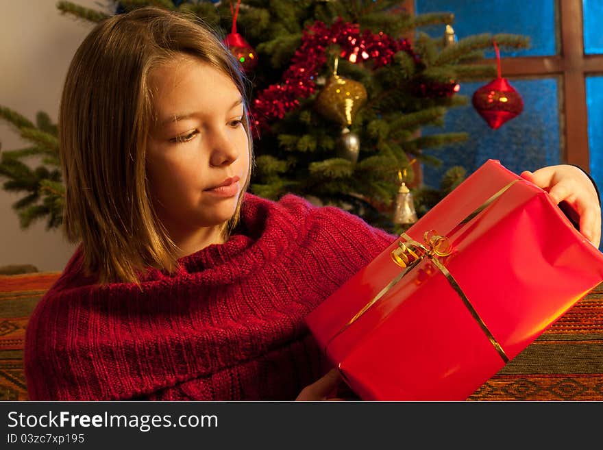 Teenager  studying christmas gift