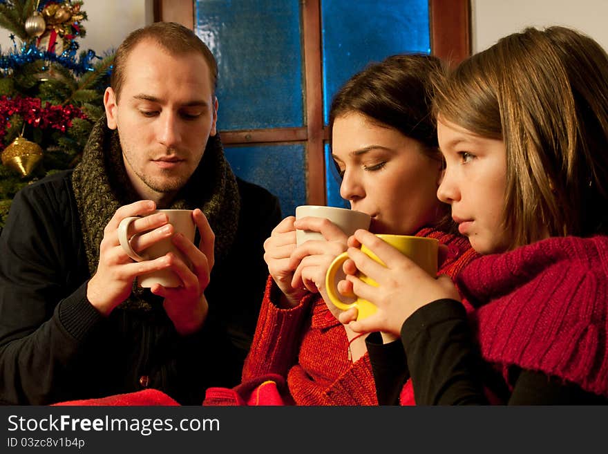 White people drinking cup of tea and sharing chirstmas moments. White people drinking cup of tea and sharing chirstmas moments