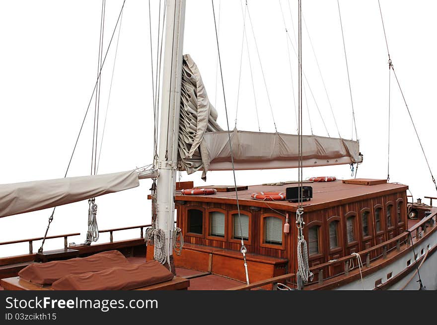 The details of an old wooden sailboat against white background. The details of an old wooden sailboat against white background.