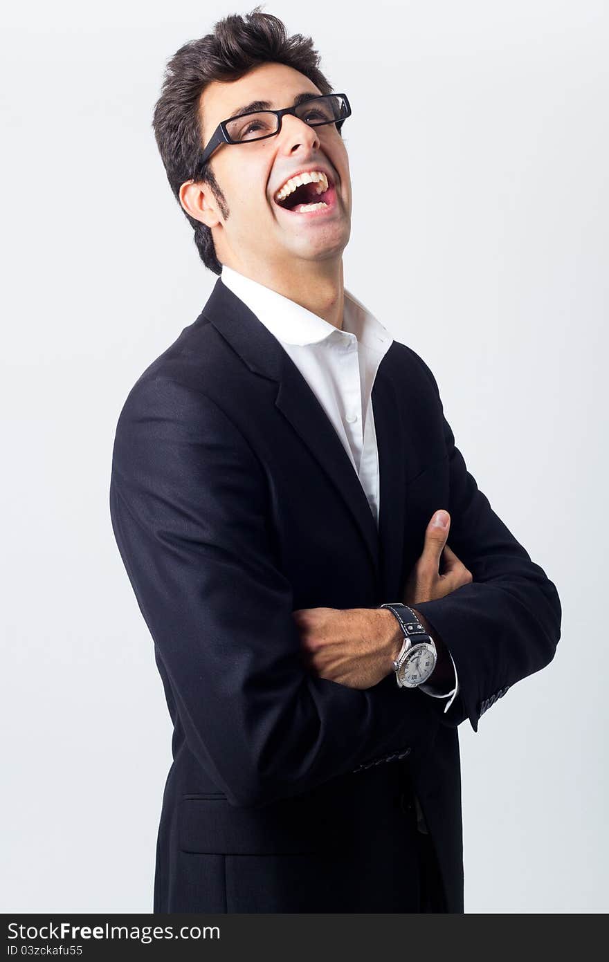 Attractive young businessman posing in front of the camera. Attractive young businessman posing in front of the camera