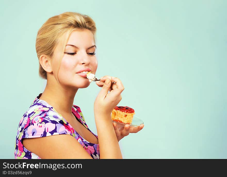 Lovely girl eating fruit cake