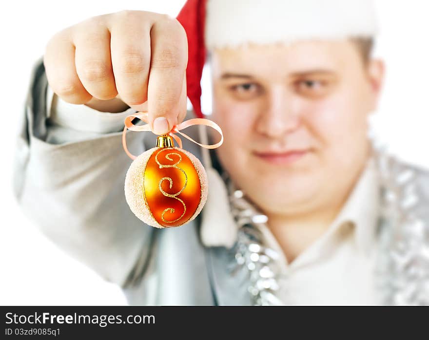 Young man holding a Christmas toy. Isolated on white background.Soft focus.