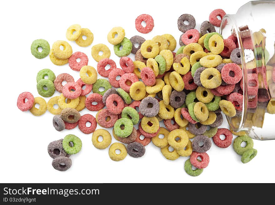 Sugary cereals in a glass jar on white background