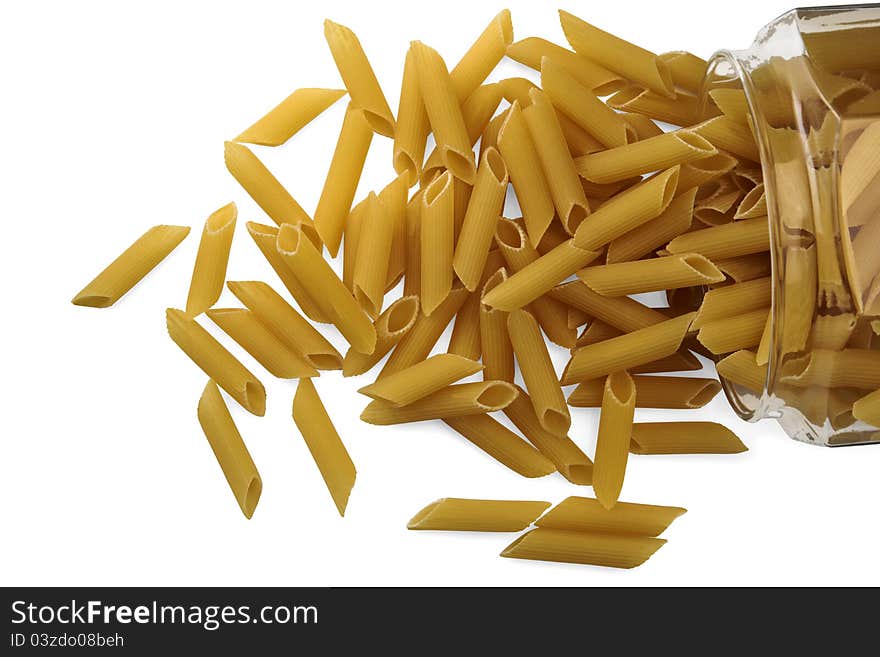 Dried pasta in a glass jar on white background. Dried pasta in a glass jar on white background