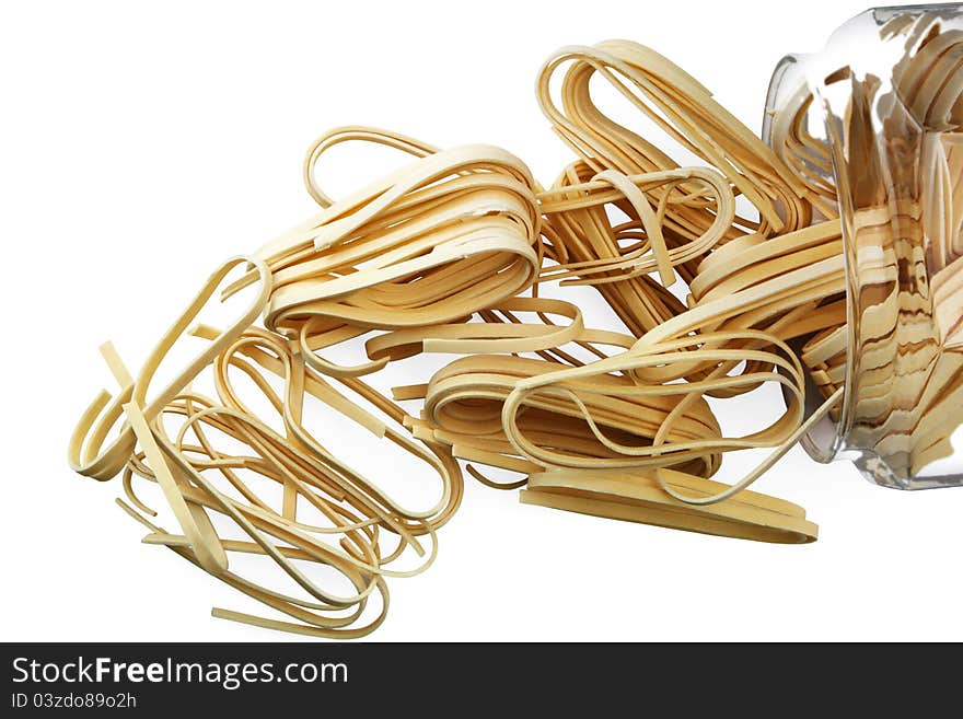 Dried pasta in a glass jar on white background. Dried pasta in a glass jar on white background