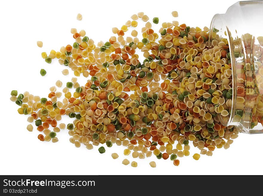 Dried pasta in a glass jar on white background. Dried pasta in a glass jar on white background