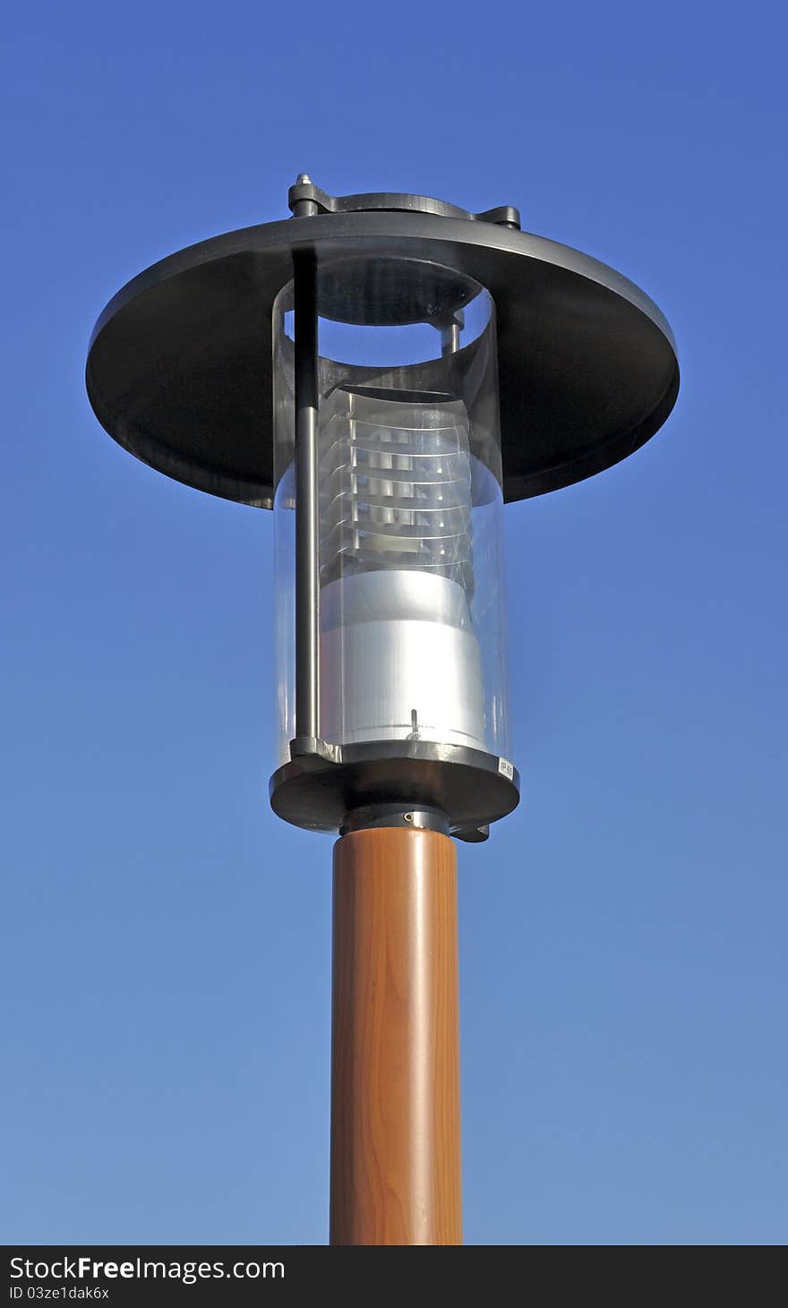 Modern ecological electric street lantern on blue sky. Modern ecological electric street lantern on blue sky