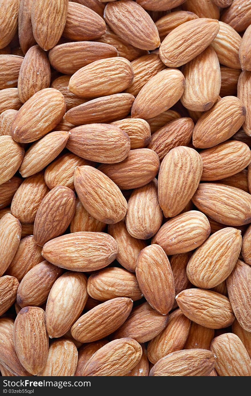 Dried almond nuts background close-up. Dried almond nuts background close-up