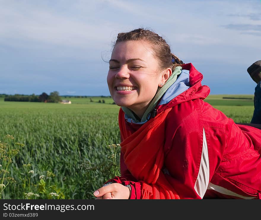 Young beautiful attractive smiling woman outdoors in nature. Young beautiful attractive smiling woman outdoors in nature