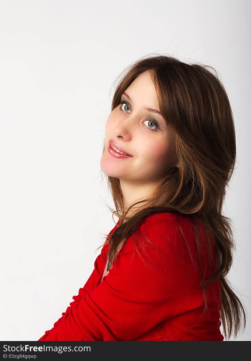 Portrait of pretty young girl in red dress in studio. Portrait of pretty young girl in red dress in studio