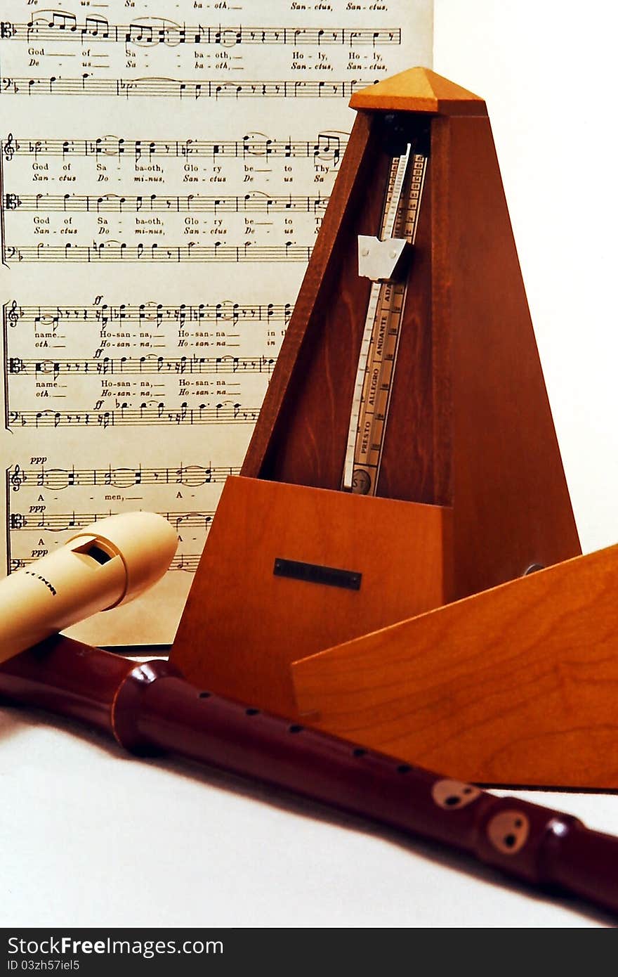 Metronome and two recorders still life with sheet-music. Metronome and two recorders still life with sheet-music