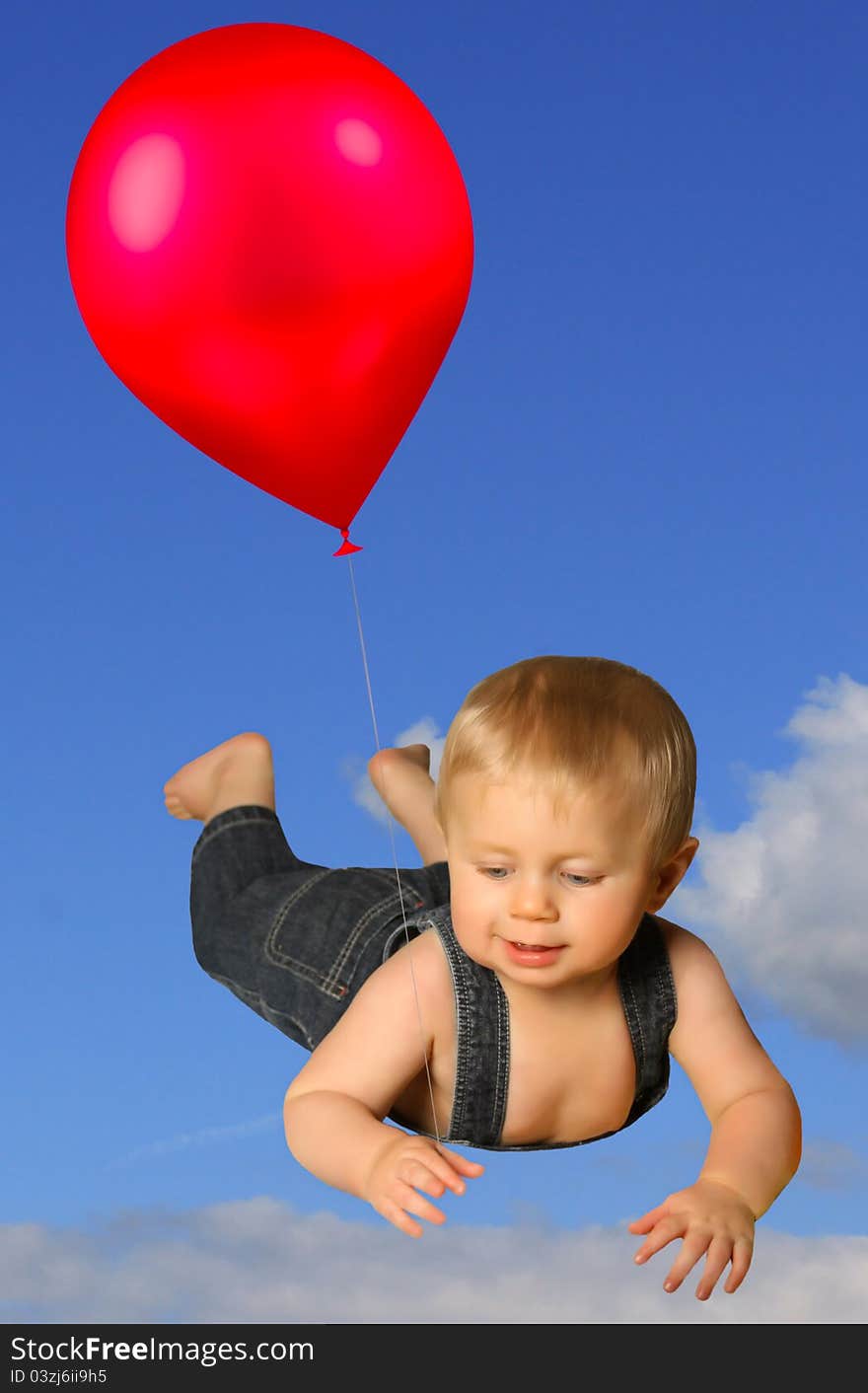 A little boy wearing a farmer's outfit and floating in the sky with a red balloon. A little boy wearing a farmer's outfit and floating in the sky with a red balloon.