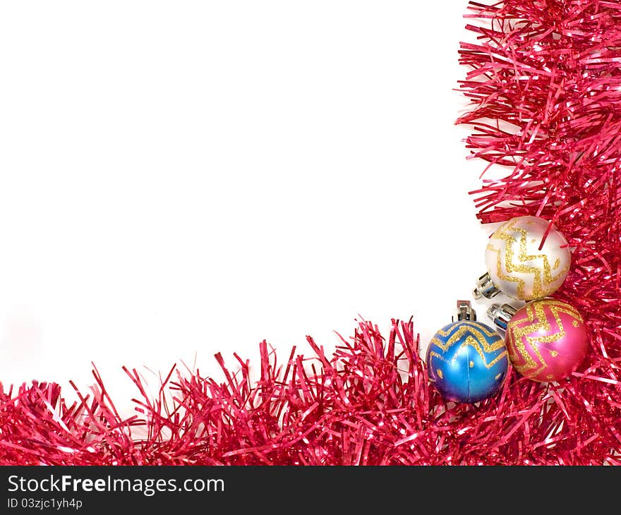 Multicolored christmas balls and red decoration.