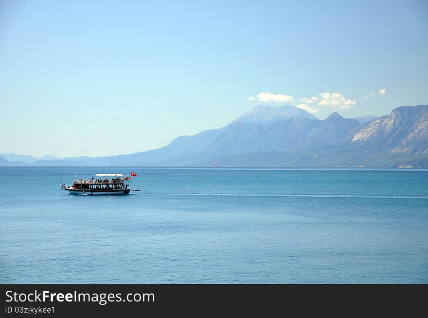 A local cruise boat crossing the bay at antalya in turkey. A local cruise boat crossing the bay at antalya in turkey