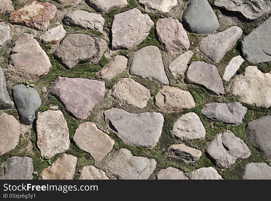 Closeup of old cobblestone pavement surface. Closeup of old cobblestone pavement surface