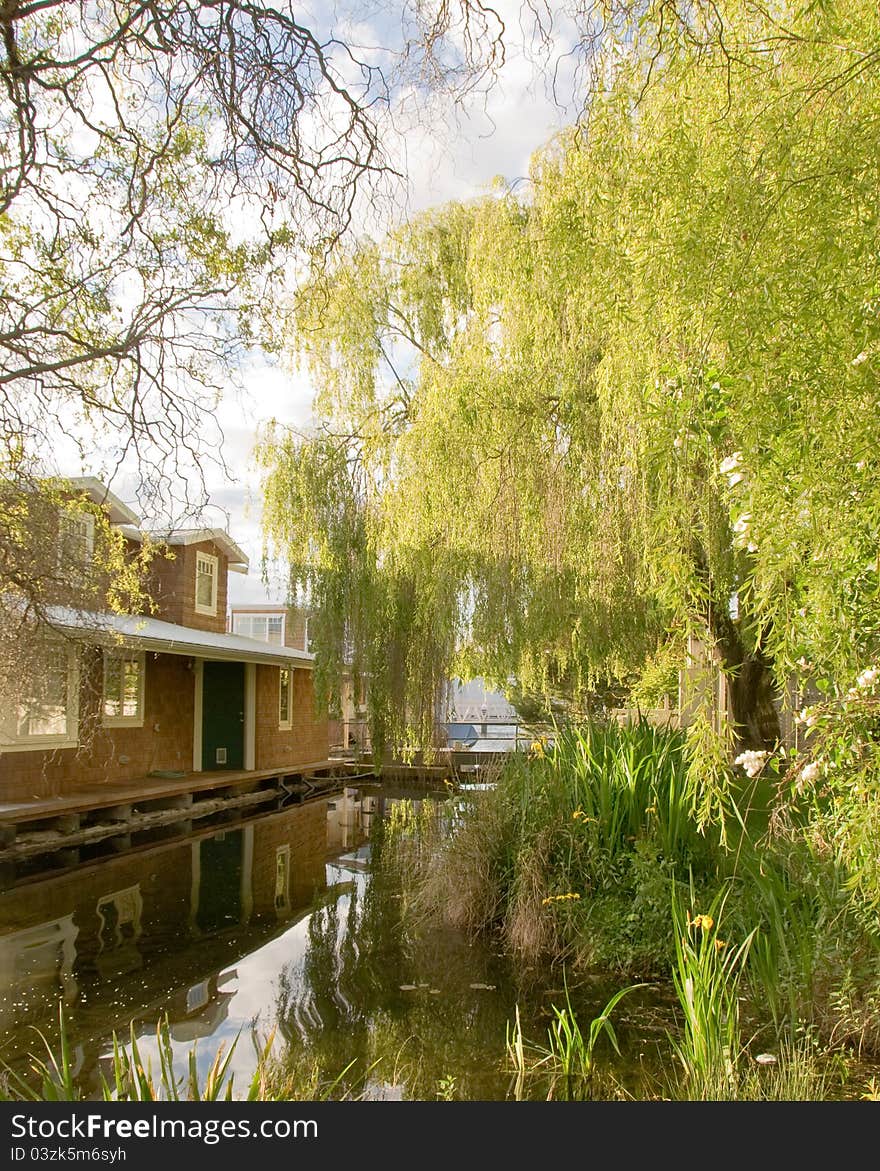 Houseboat  with reflections on a lake.