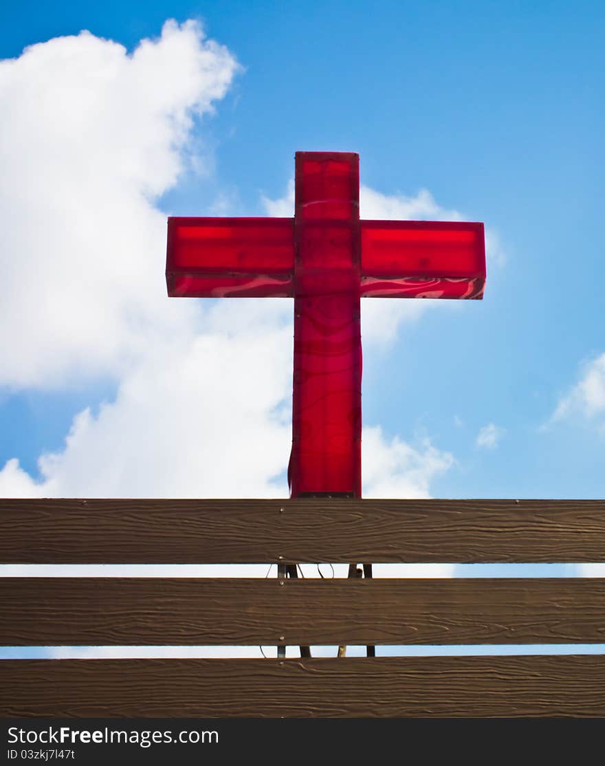 This is a red cross on blue sky background