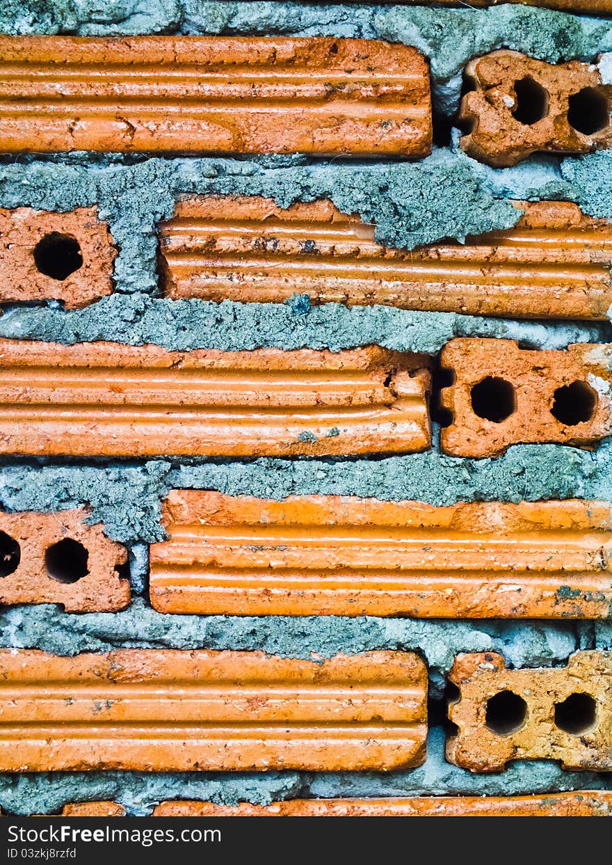 This is a brick pattern wall it's have a orange colour. This is a brick pattern wall it's have a orange colour